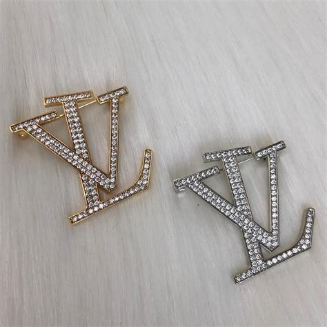 louis vuitton brooches.